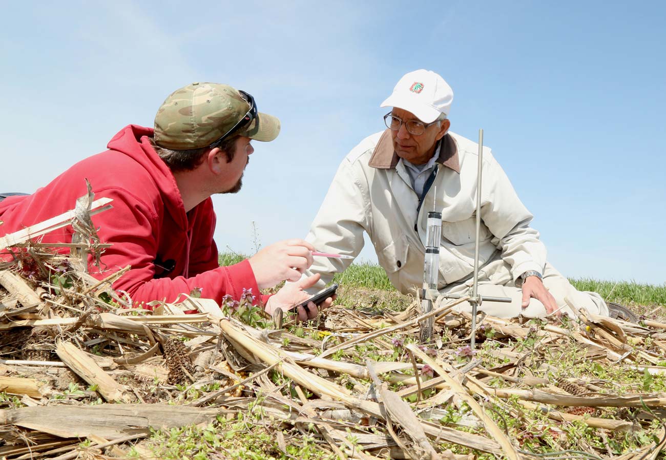 Dr. Lal works with a student at OSU’s Western Agricultural Research Station in Clark County.  (Photo courtesy of Ohio State University / Ken Chamberlain)
