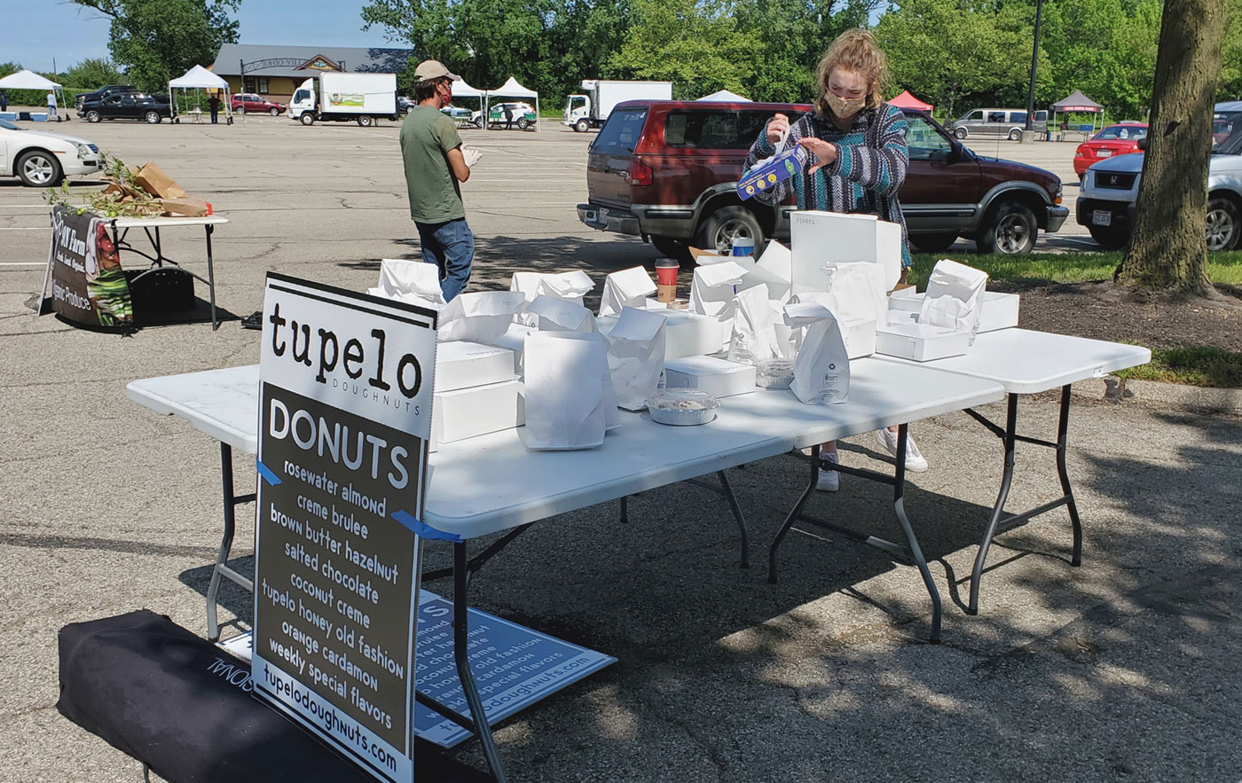 Pre-ordered items are packaged and awaiting pickup at the Clintonville market. Photo by Edible Columbus.