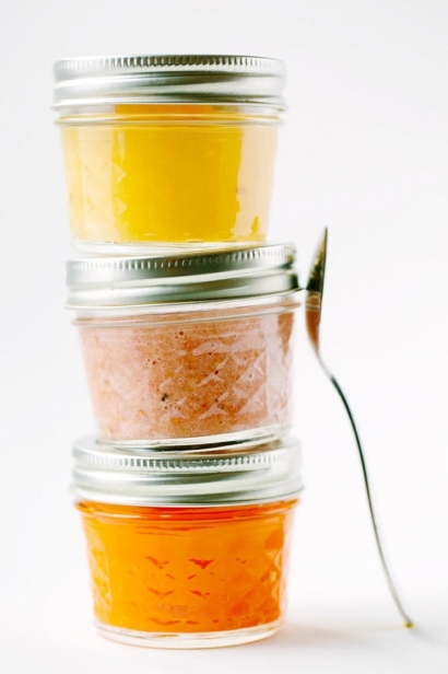 Baby food portioned and stored in glass jars, which can be reheated in warm water before serving.