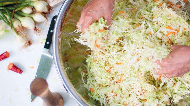 mixing sauerkraut ingredients